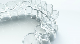 Closeup of mail-in clear aligners in Bethel Park 