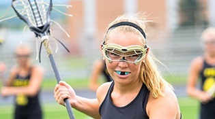 Female lacrosse player with custom sportsguard