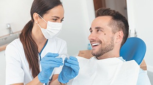Patient and dentist discussing the cost of clear aligners in Bethel Park 