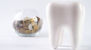 3D Model of a tooth next to a jar of coins
