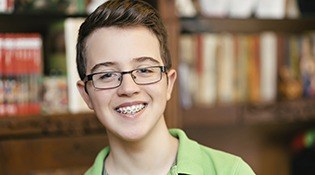 Boy with glasses and braces