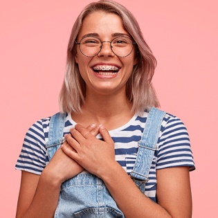young smiling woman wearing overalls