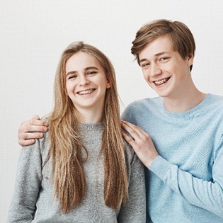 brother and sister with braces