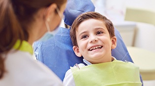Boy smiling in dental chair