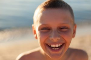 Boy with braces smiling