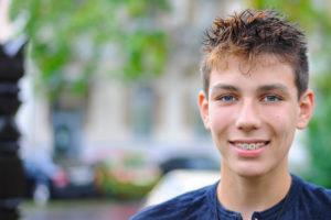 Teenage boy wearing braces 