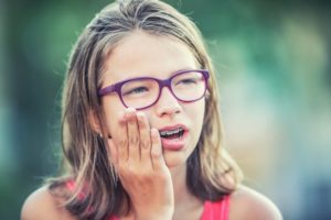 girl with braces pain