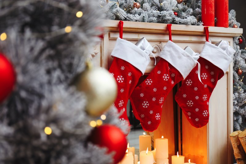 Christmas stockings hung by the fire.